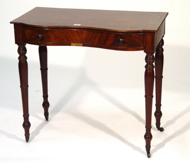 Appraisal: Victorian Mahogany Serpentine fronted side table fitted a freeze drawer