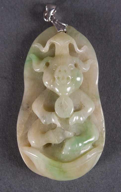 Appraisal: Chinese carved jade pendant depicting Buddhist deities on leaf-form back