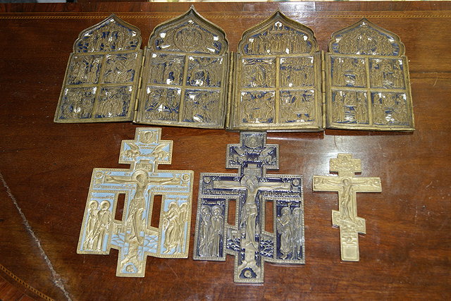 Appraisal: A FOLDING BRASS AND ENAMEL TABLE TOP ICON with scenes