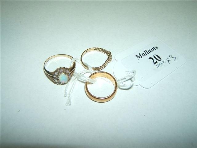 Appraisal: A ct gold wedding band an opal set gold ring