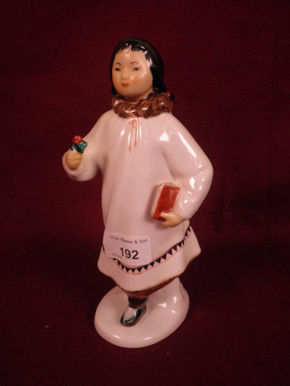 Appraisal: A Russian porcelain figure of an eskimo girl carrying a