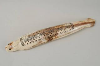 Appraisal: Inuit Scrimshaw Seal Cribbage Board Vintage Inuit scrimshaw seal form