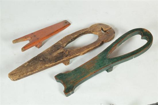 Appraisal: THREE WOODEN BOOTJACKS American nd half- th century All from