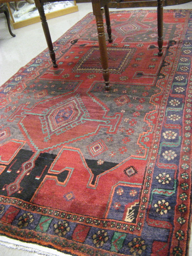 Appraisal: PERSIAN TRIBAL CARPET three geometric design with scattered stylized flower