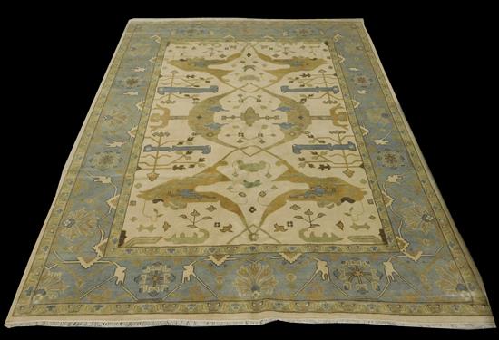 Appraisal: RUG Oushak beige field with accents of sand emerald grey