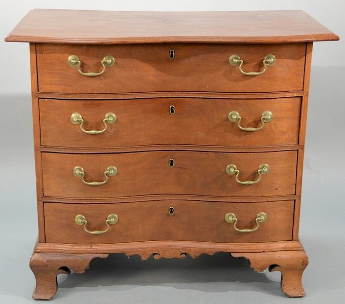 Appraisal: Mahogany diminutive oxbow chest having overhanging top over four conforming