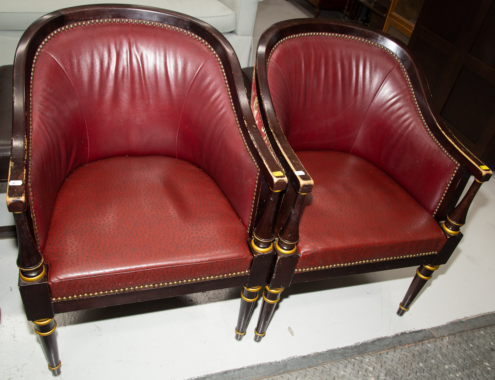 Appraisal: A PAIR OF CLASSICAL STYLE BARREL BACK ARM CHAIRS Late