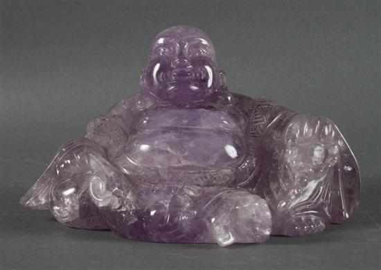 Appraisal: Chinese carved amethyst quartz Buddha figure modeled in traditional pose