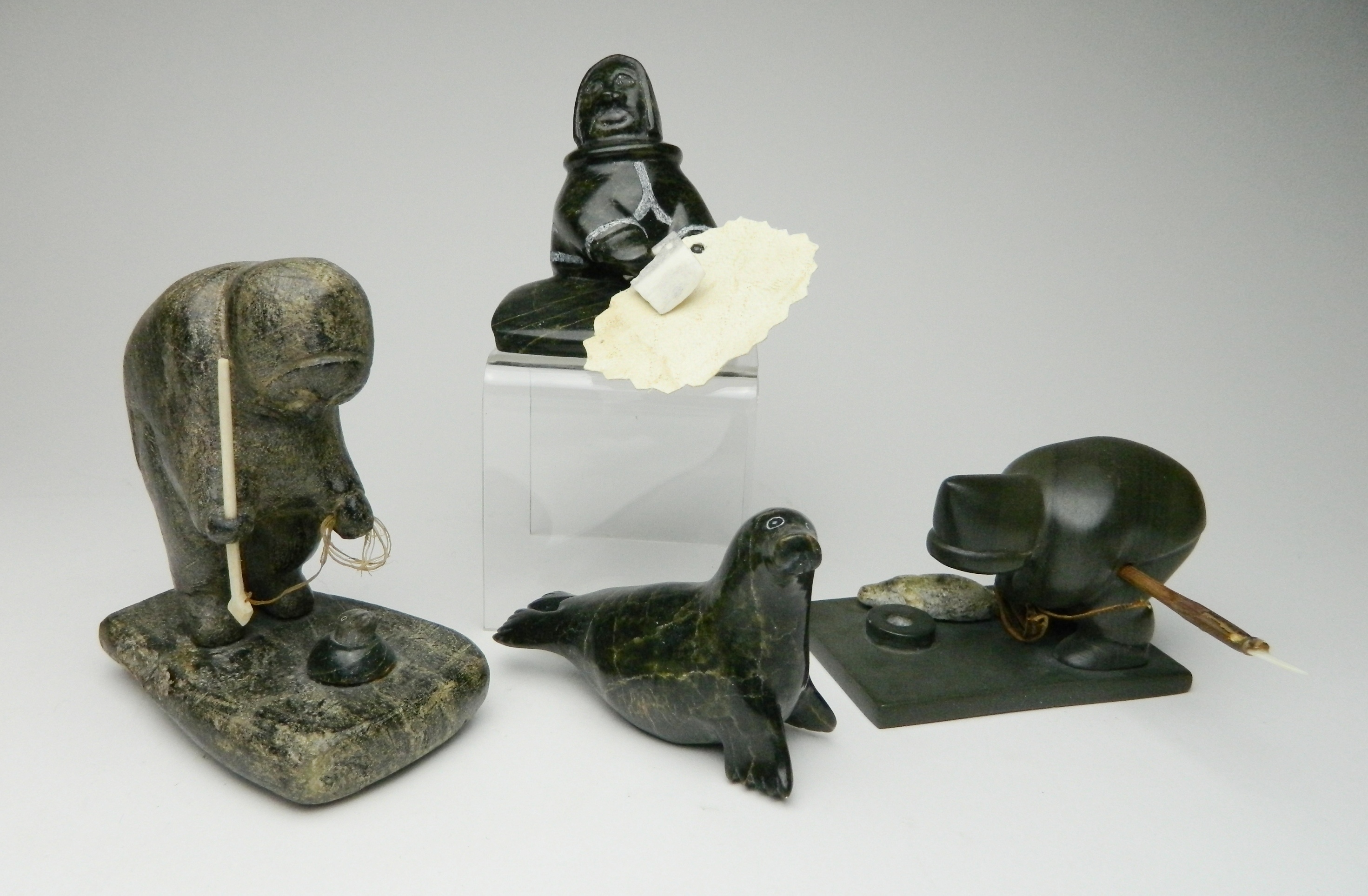 Appraisal: Inuit stone carvings Izasie Kopalie Artic Bay- Iqaluit- Fisherman ''