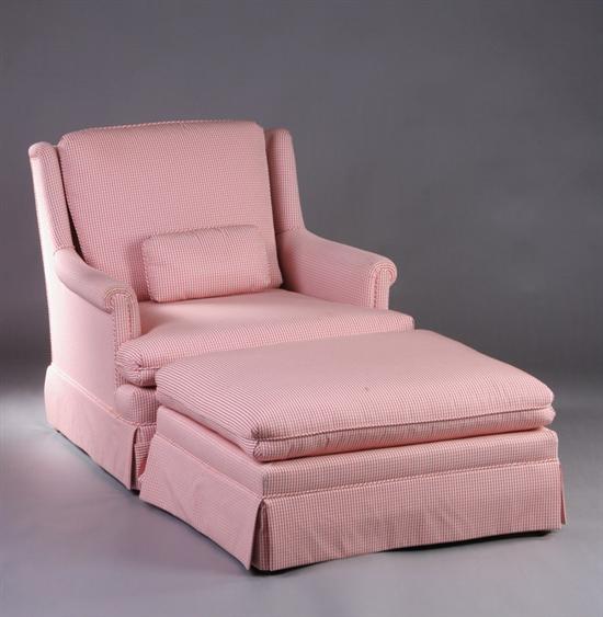 Appraisal: CONTEMPORARY UPHOLSTERED ARMCHAIR AND OTTOMAN th century Gracious upholstered backrest