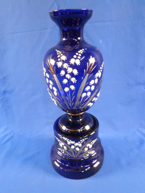 Appraisal: A Victorian blue glass vase and stand each decorated with