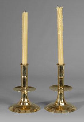 Appraisal: Pair trumpet-base brass candlesticks mid-drip plates above trumpet-shaped bases English