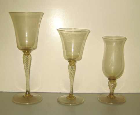 Appraisal: VENETIAN BLOWN AMBER GLASS STEMWARE Each reverted bell form on