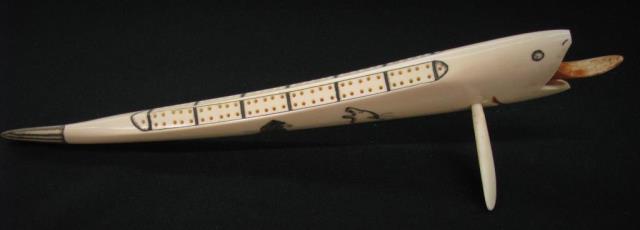 Appraisal: Inuit style carved ivory tusk cribbage board whale motif long