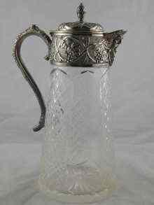 Appraisal: A hobnail panel cut glass claret jug with silver plated