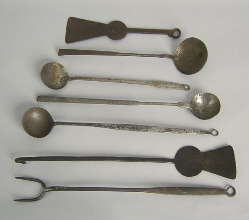 Appraisal: Four wrought iron ladles together with a flesh fork and