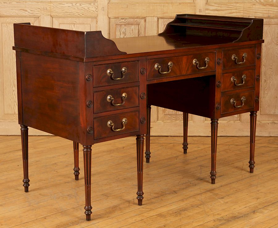 Appraisal: MAHOGANY SEVEN DRAWER WRITING DESK A Sheraton style mahogany writing