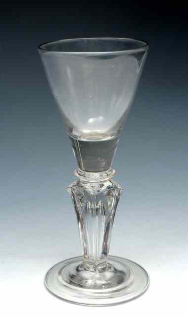 Appraisal: A TRUMPET BOWL WINE GLASS on four sided moulded stem