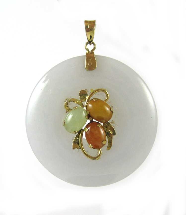 Appraisal: JADE AND FOURTEEN KARAT GOLD PENDANT with a lavender jade