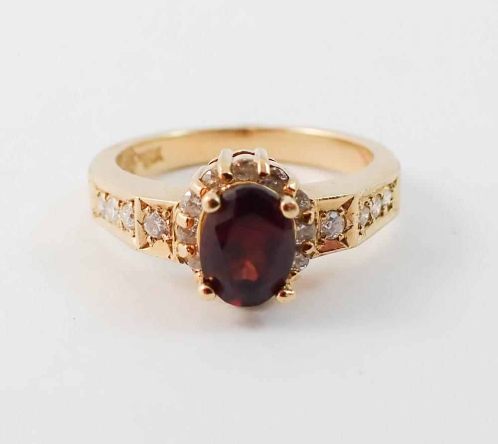 Appraisal: GARNET DIAMOND AND EIGHTEEN KARAT GOLD RING set with round-cut