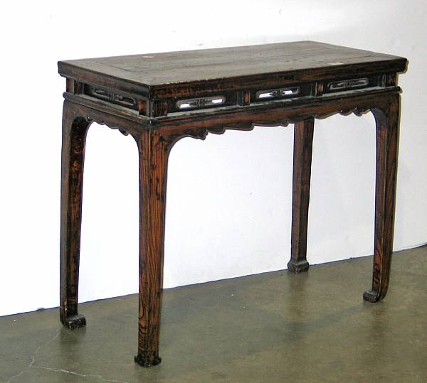 Appraisal: A Chinese carved wood rectangular table Qing Dynasty The top