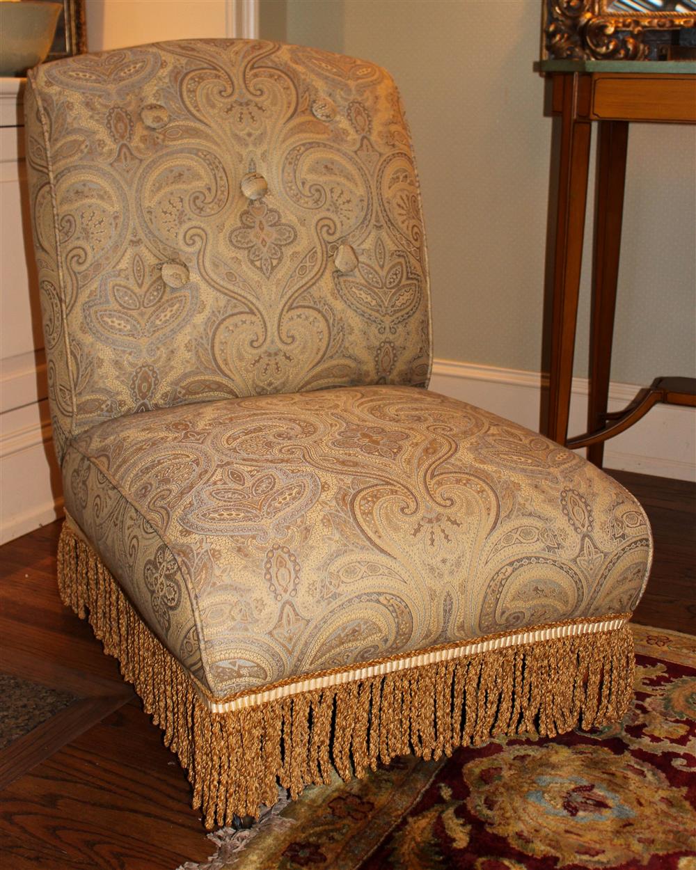 Appraisal: PAIR OF PAISLEY UPHOLSTERED SLIPPER CHAIRS TOGETHER WITH AN OTTOMAN