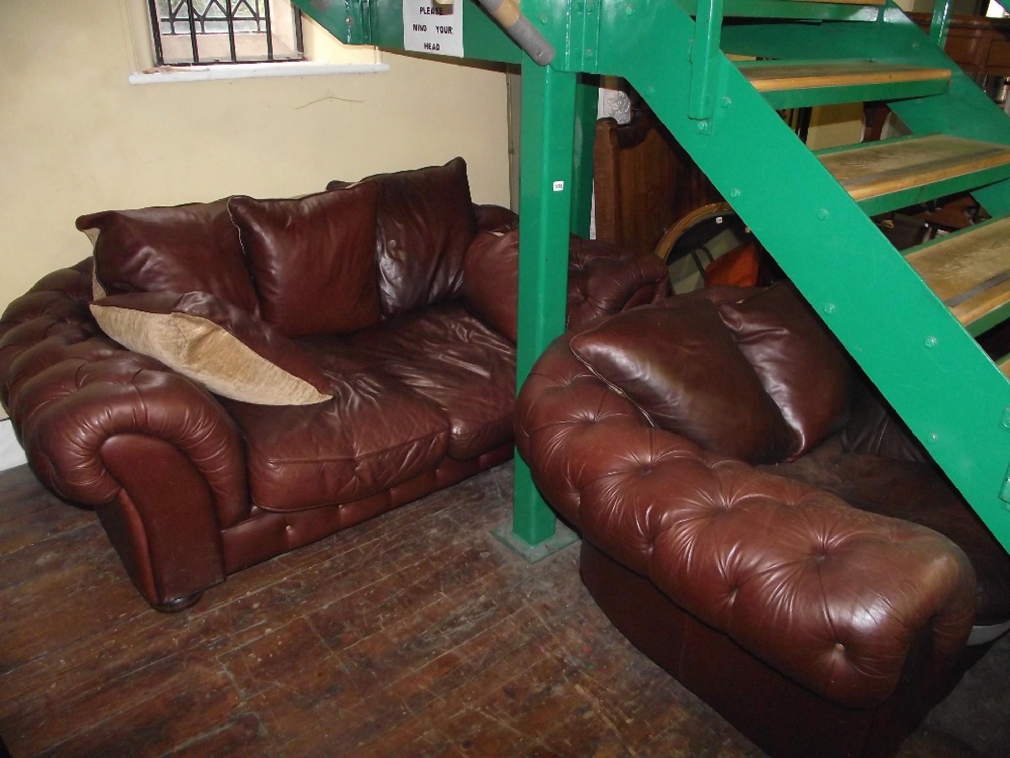 Appraisal: A substantial contemporary mid tan coloured leather two seat sofa