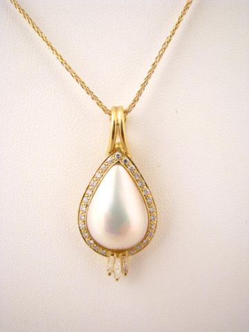 Appraisal: K yellow gold pear shaped pearl pendant with round accent