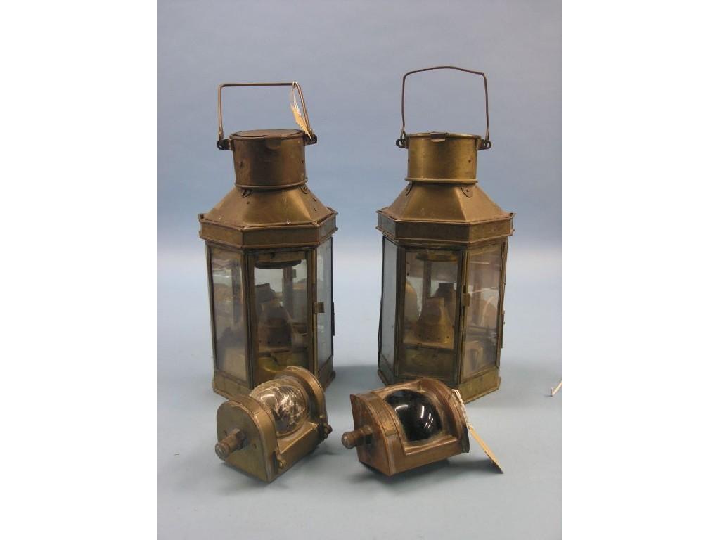 Appraisal: A pair of brass ship's lamps each with carrying handle