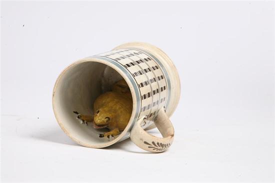 Appraisal: MOCHA MUG WITH FROG English st quarter th-century Engine turned