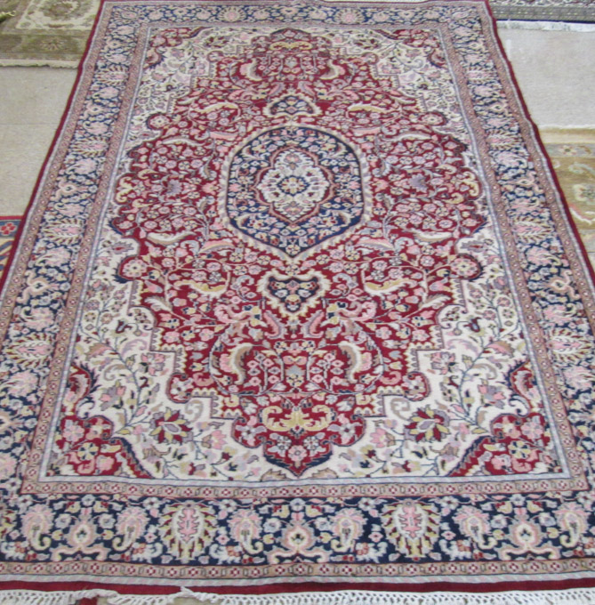 Appraisal: HAND KNOTTED ORIENTAL AREA RUG Indo-Persian floral and central floral