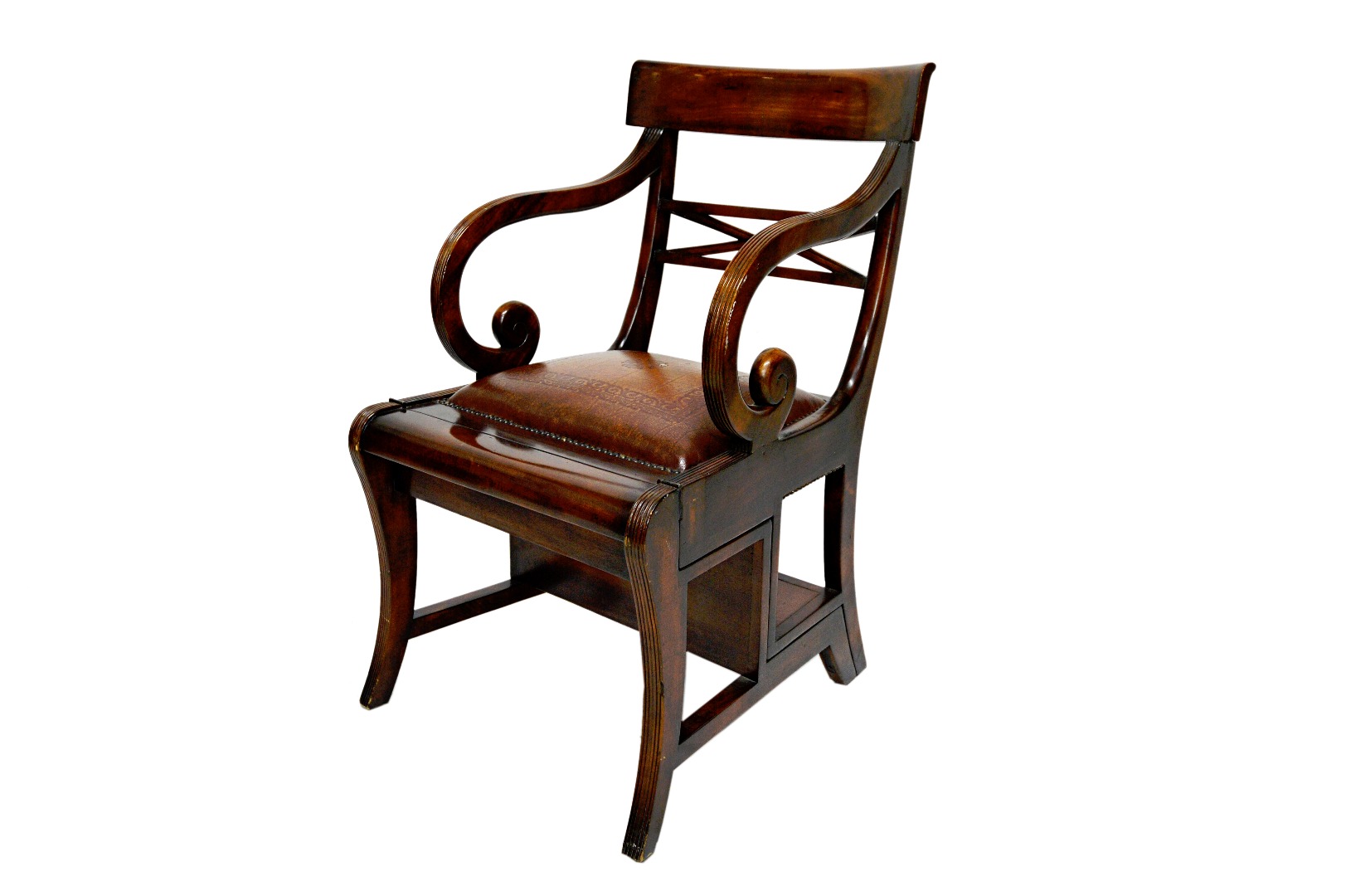 Appraisal: A Regency style mahogany metamorphic library armchair on sabre supports