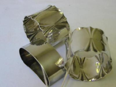 Appraisal: A PAIR OF NAPKIN RINGS with frill moulded edging wide