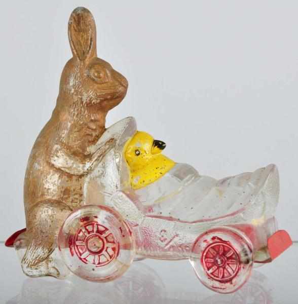 Appraisal: Glass Rabbit Pushing Chick Candy Container Description Made by V