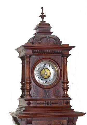 Appraisal: A GERMAN WALNUT CLOCK POLYPHON the silvered dial with Gothic