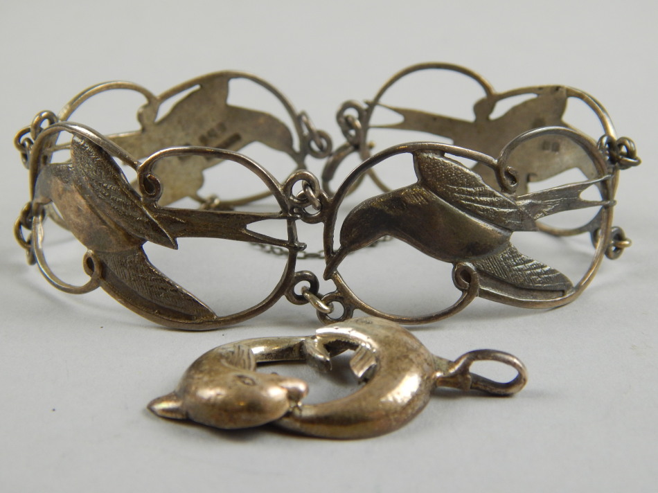 Appraisal: A silver bird bracelet and a dolphin pendant the bangle