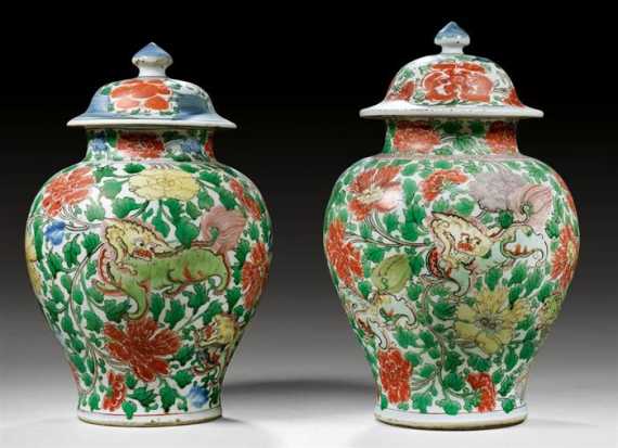 Appraisal: A PAIR OF COVERED VASES WITH WUCAI DESIGN OF FOO-DOGS