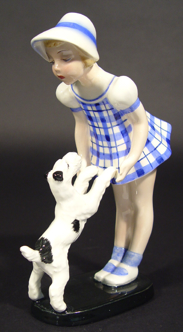 Appraisal: Goldscheider young girl and begging dog figure group with hand