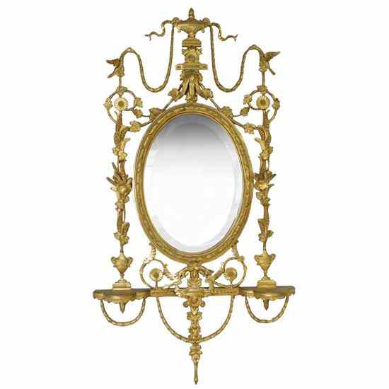 Appraisal: An English Adam Style Giltwood and Composition Oval Wall Mirror