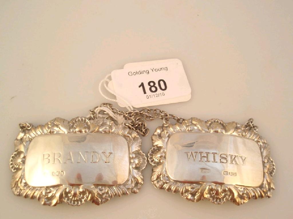 Appraisal: A modern silver whisky decanter label and a brandy decanter