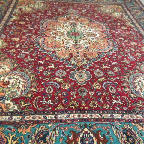 Appraisal: Tabriz Persian Handmade Room Size Rug animals elaborate florals great