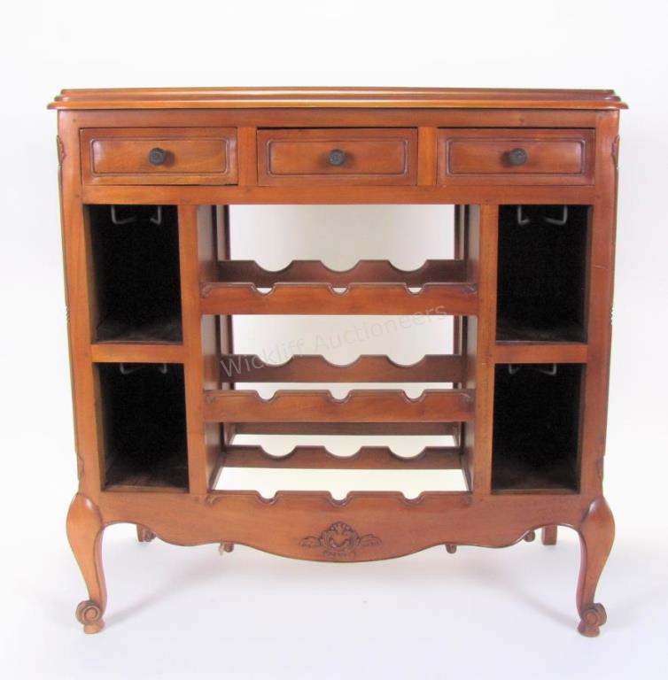 Appraisal: A traditional-style wine serving cabinet with bottle storage stemware racks