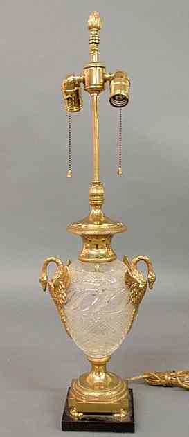 Appraisal: Cut glass and brass table lamp with brass swan mounts