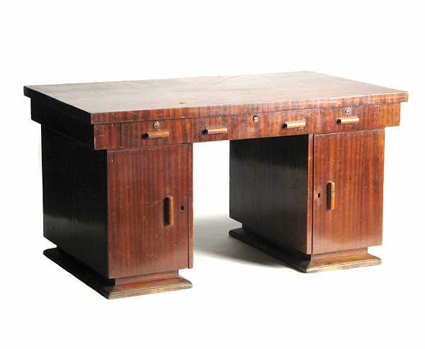 Appraisal: An Art Deco mahogany veneered pedestal desk height in width