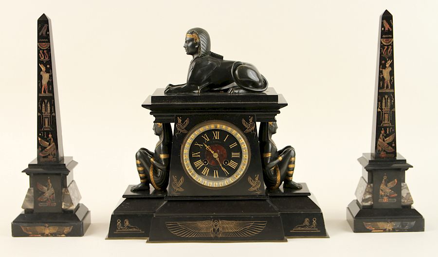 Appraisal: EGYPTIAN REVIVAL ONYX CLOCK GARNITURE SET A late nineteenth century