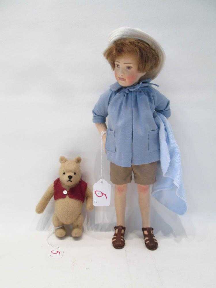 Appraisal: TWO R JOHN WRIGHT FELT DOLLS Christopher Robin limited edition