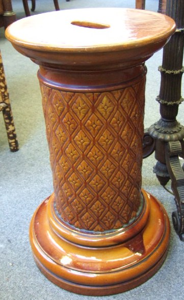 Appraisal: A Burmantofts circular jardinare stand with relief moulded geometric design