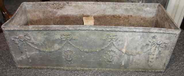 Appraisal: A PAIR OF LEAD PLANTERS of rectangular form with classical