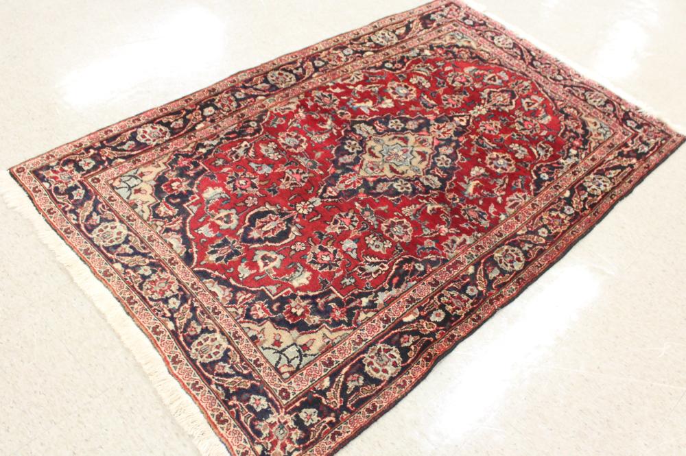 Appraisal: HAND KNOTTED PERSIAN AREA RUG floral and central floral medallion