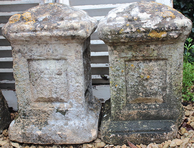 Appraisal: A PAIR OF CARVED STONE BOLLARDS with pyramidal tops and